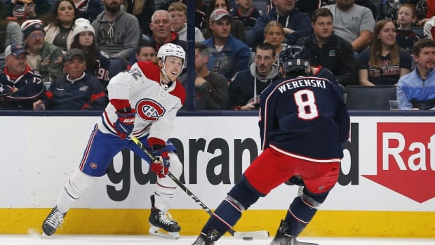 Apr 13, 2022; Columbus, Ohio, USA; Montreal Canadiens center Rem Pitlick (32) looks to pass as Columbus Blue Jackets defenseman Zach Werenski (8) defends during the first period at Nationwide Arena. Mandatory Credit: Russell LaBounty-USA TODAY Sports
